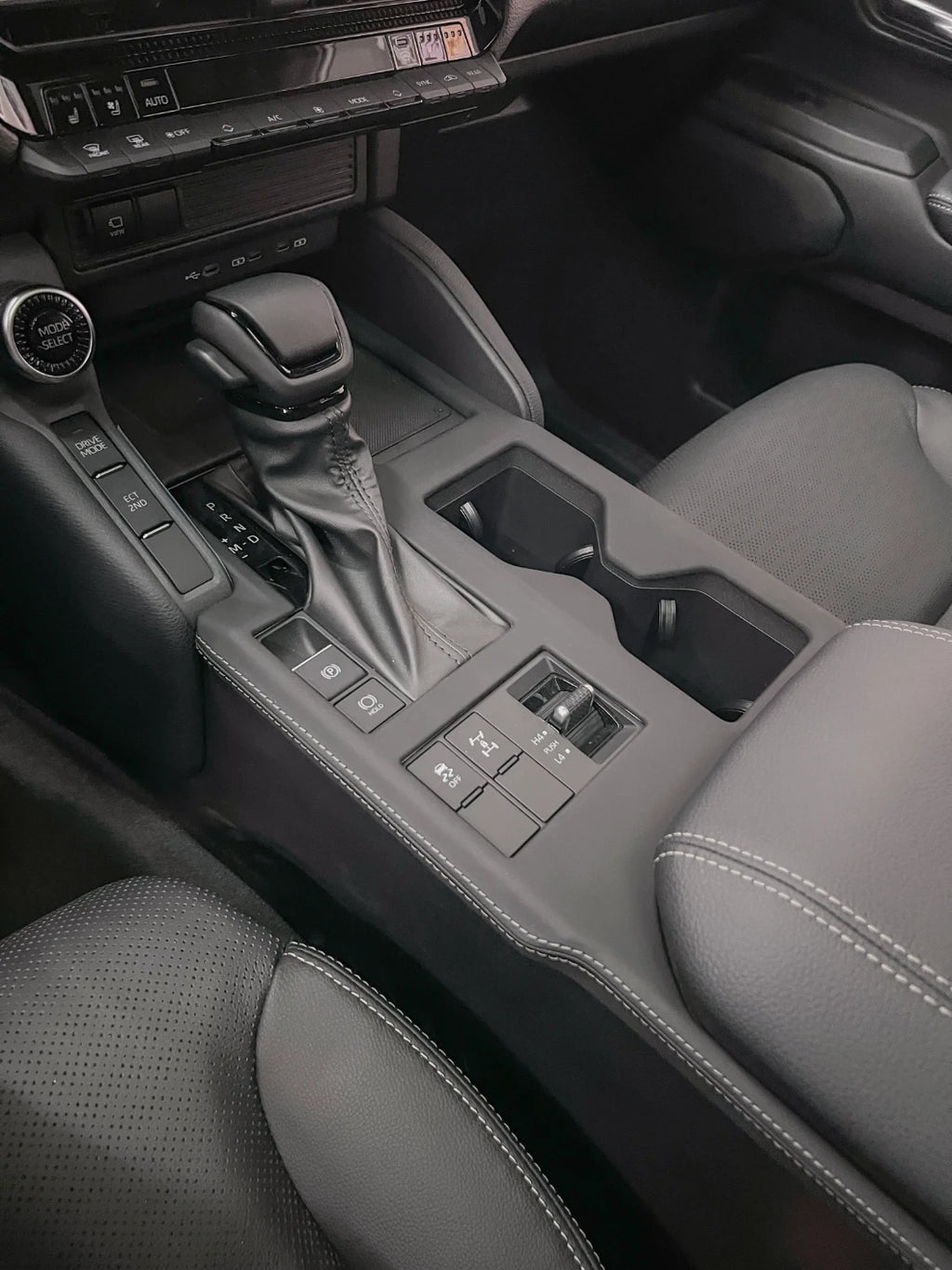 Prado J250 gear selector area leather trim overlay detail on center console