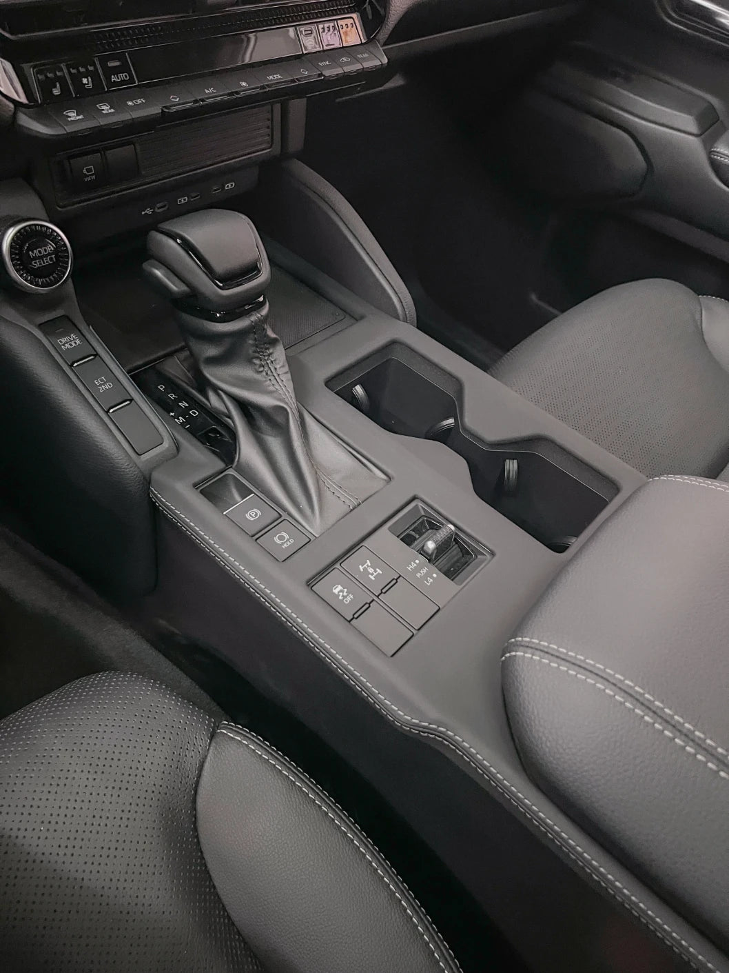 Prado J250 gear selector area leather trim overlay detail on center console